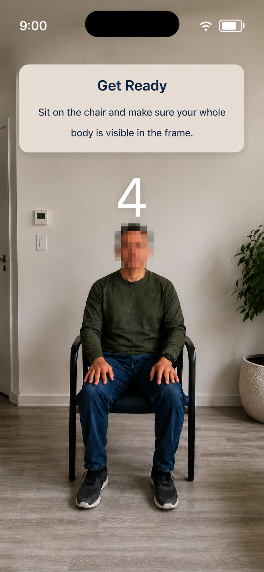 Kelvin Reach provides guided in-app video capture as part of the remote clinical assessment workflow, allowing patients to record themselves completing protocol defined tasks at home using the front-facing camera on their own device, a phone or a tablet. Recording can also start and stop automatically when required by the study protocol, enabling hands-free video capture during assessments. In this example, a seated patient prepares for an at-home assessment while the app instructs them to sit on a chair with their whole body visible in the frame and displays a countdown before recording.